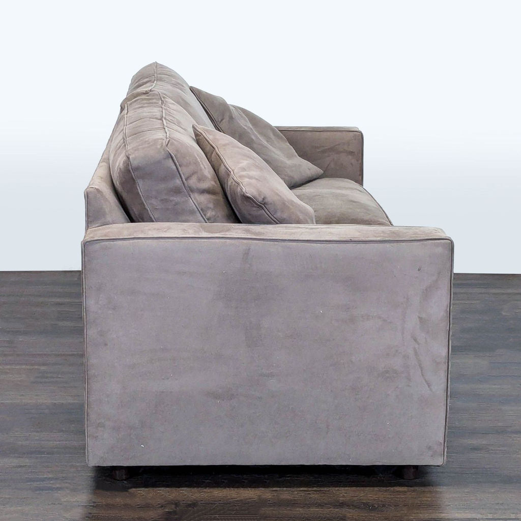 Room & Board 3-seat sofa featuring clean lines, neutral upholstery, and two pillows, ideal for living rooms or offices.