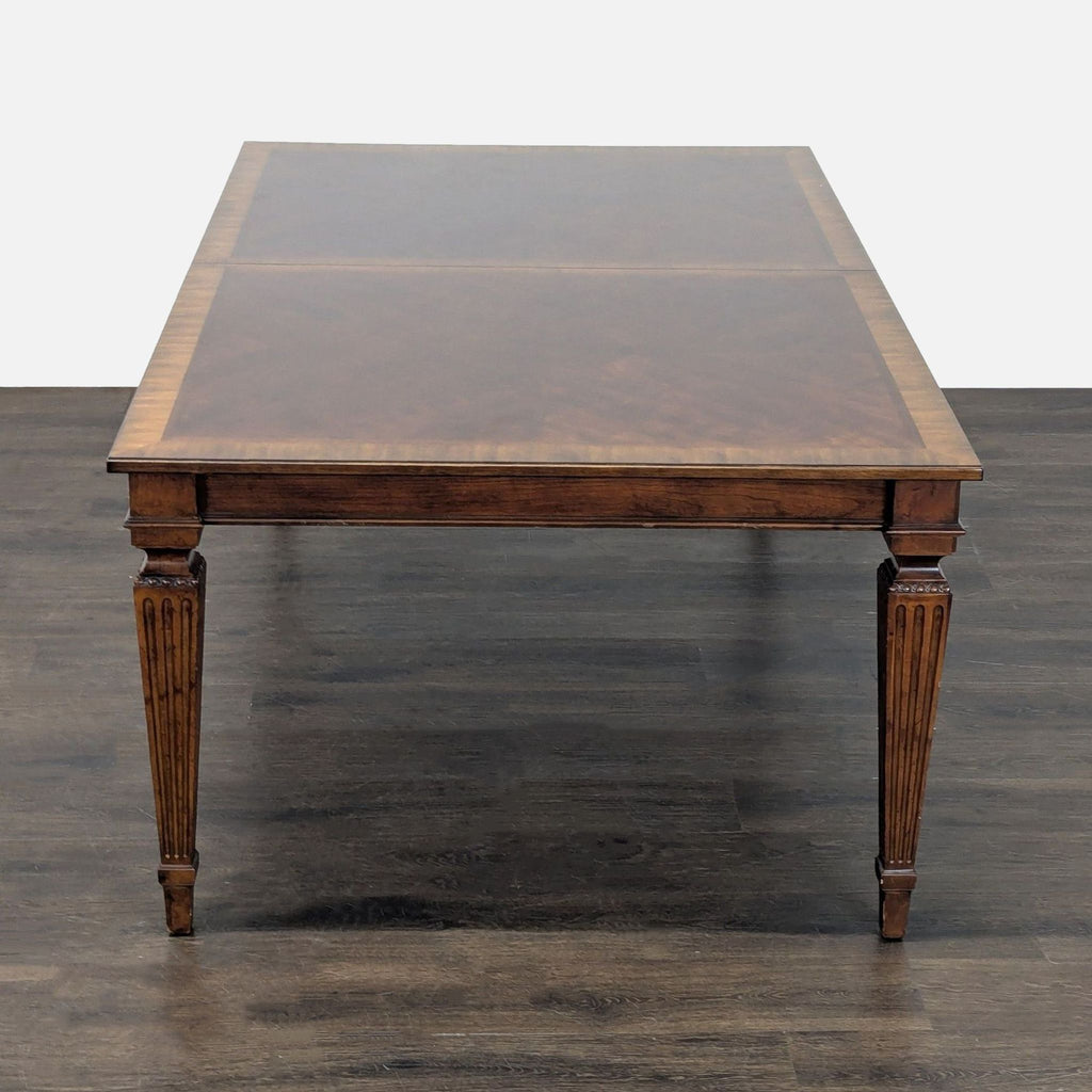 Dining room set: Ethan Allen wooden table with carved details and six comfortable, matching chairs.
