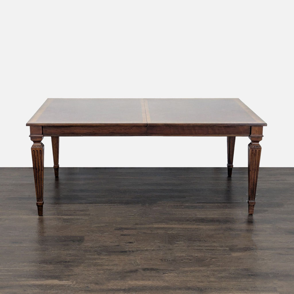 Classic extendable dining table and six patterned chairs by Ethan Allen, ideal for family dining.  