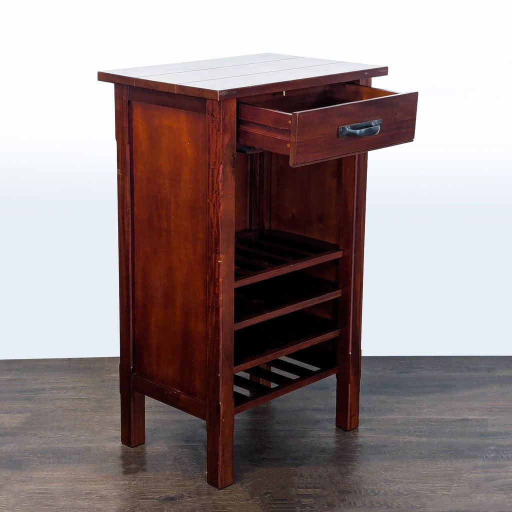 Wooden cabinet from Pottery Barn with one drawer and storage for 20 bottles and glassware.