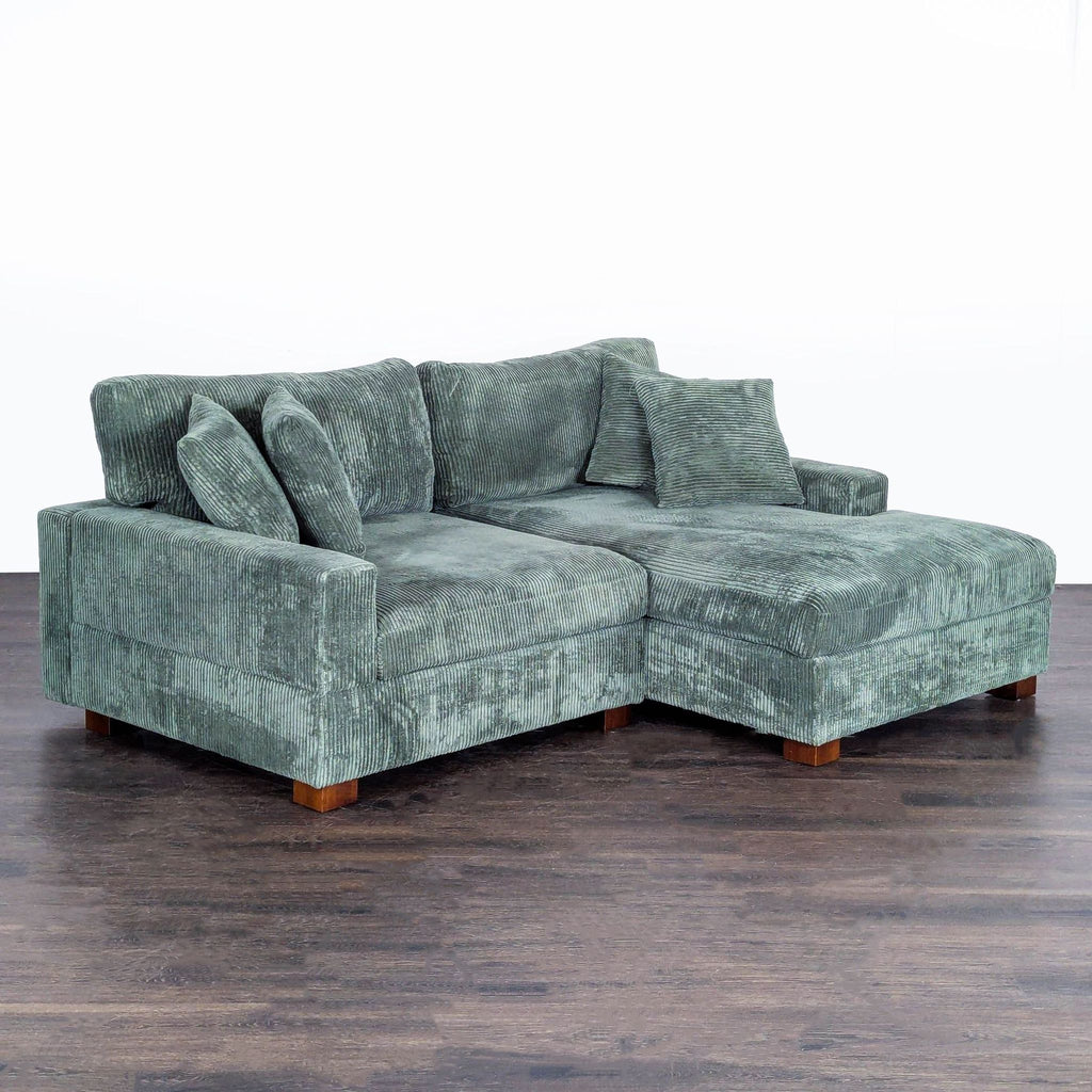 Modern Uixe 2-piece green sectional features plush faux rabbit fur fabric and comes with four coordinating pillows.