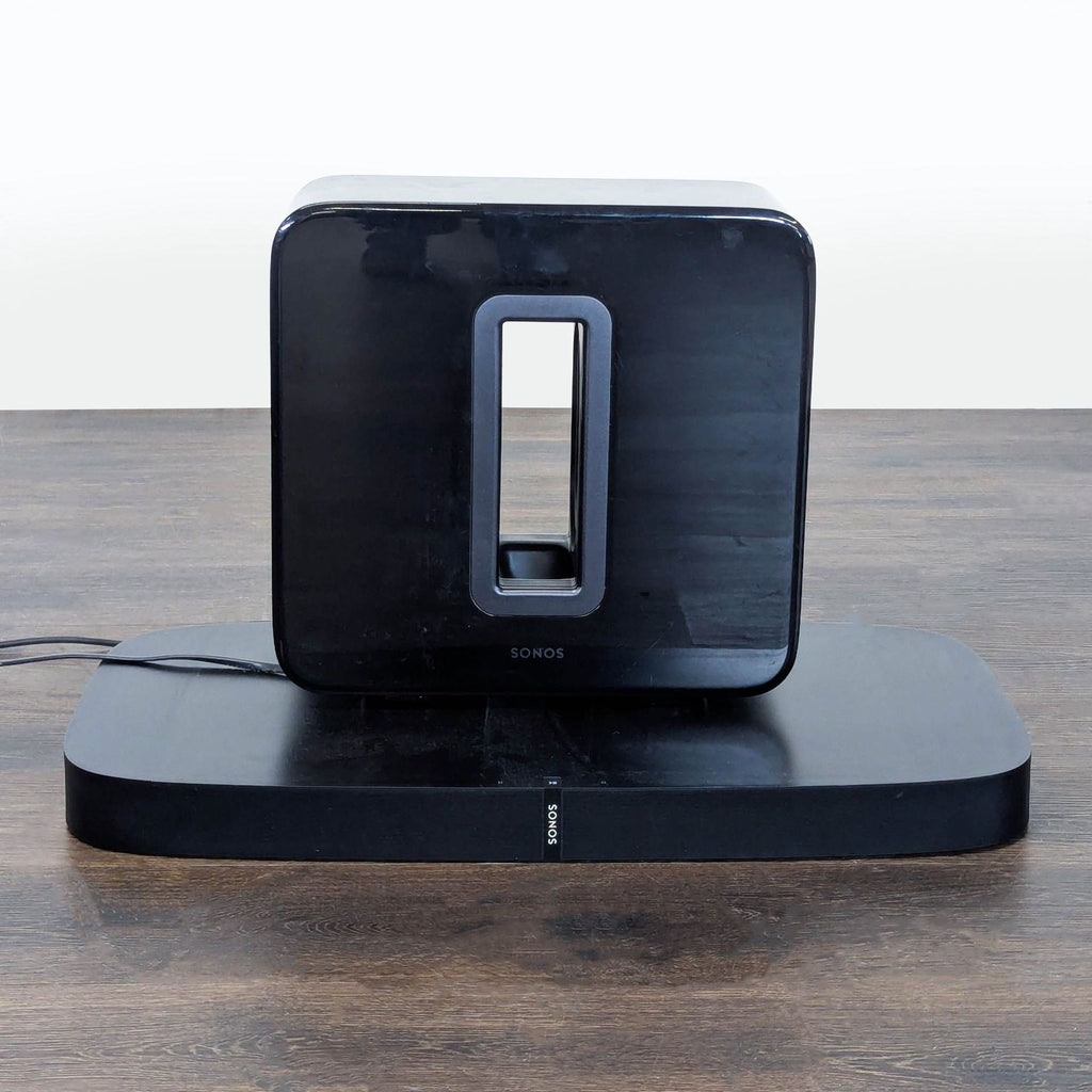 Sonos Subwoofer and Playbase combo in black, perfect for boosting home audio quality and bass.  