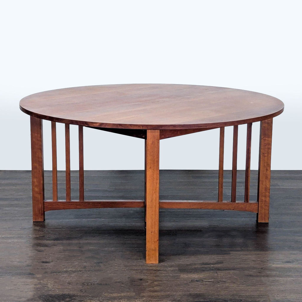 2. Elegant Thos Moser dining set featuring a rectangular table and handcrafted wooden chairs.