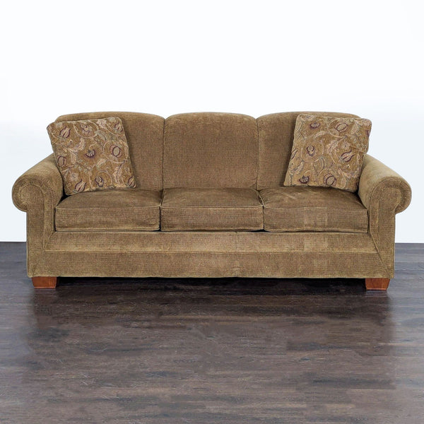 La-Z-Boy brown sleeper sofa with rolled arms, patterned pillows, and pull-out bed for added sleeping space.  