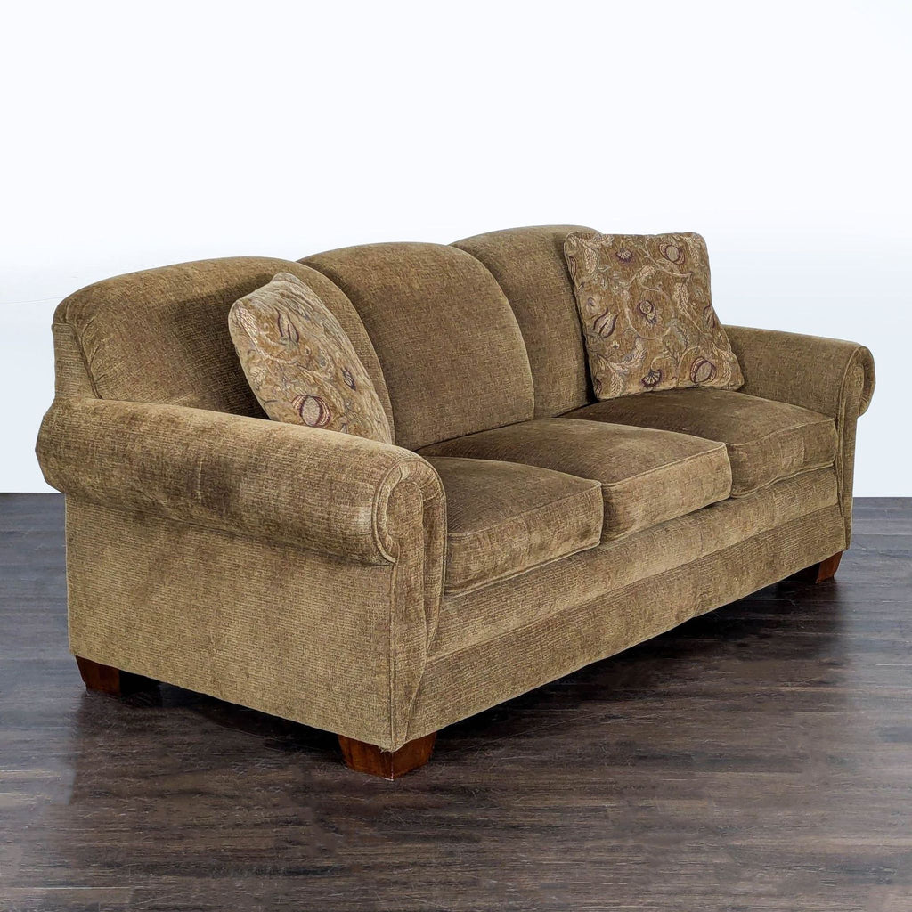 La-Z-Boy three-seater sleeper sofa with rolled arms and two accent pillows, converts easily to a bed.