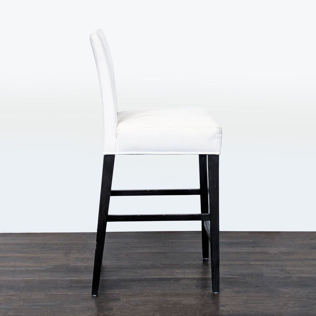 2. Rene Cazares bench stool with plush cushion and sturdy wood base, ideal for living room seating.
