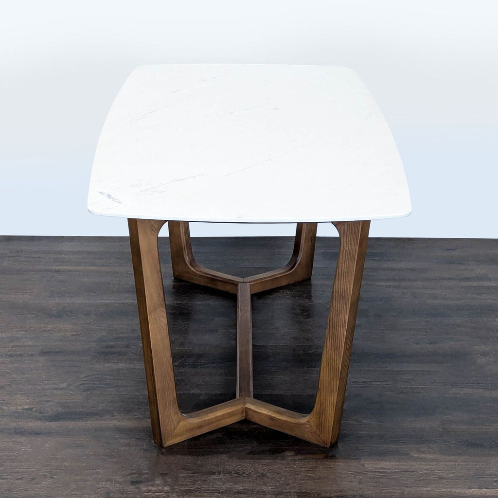 Rove Concepts dining table featuring a sealed marble surface and sturdy ash wood base.