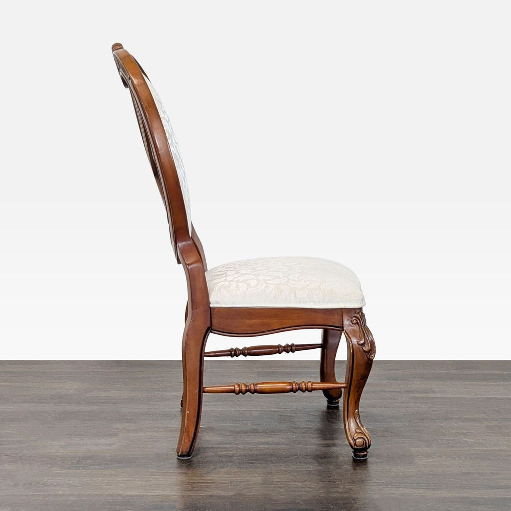 2. Sleek, minimalist dining chair featuring a high back and metal frame, set on a hardwood floor.