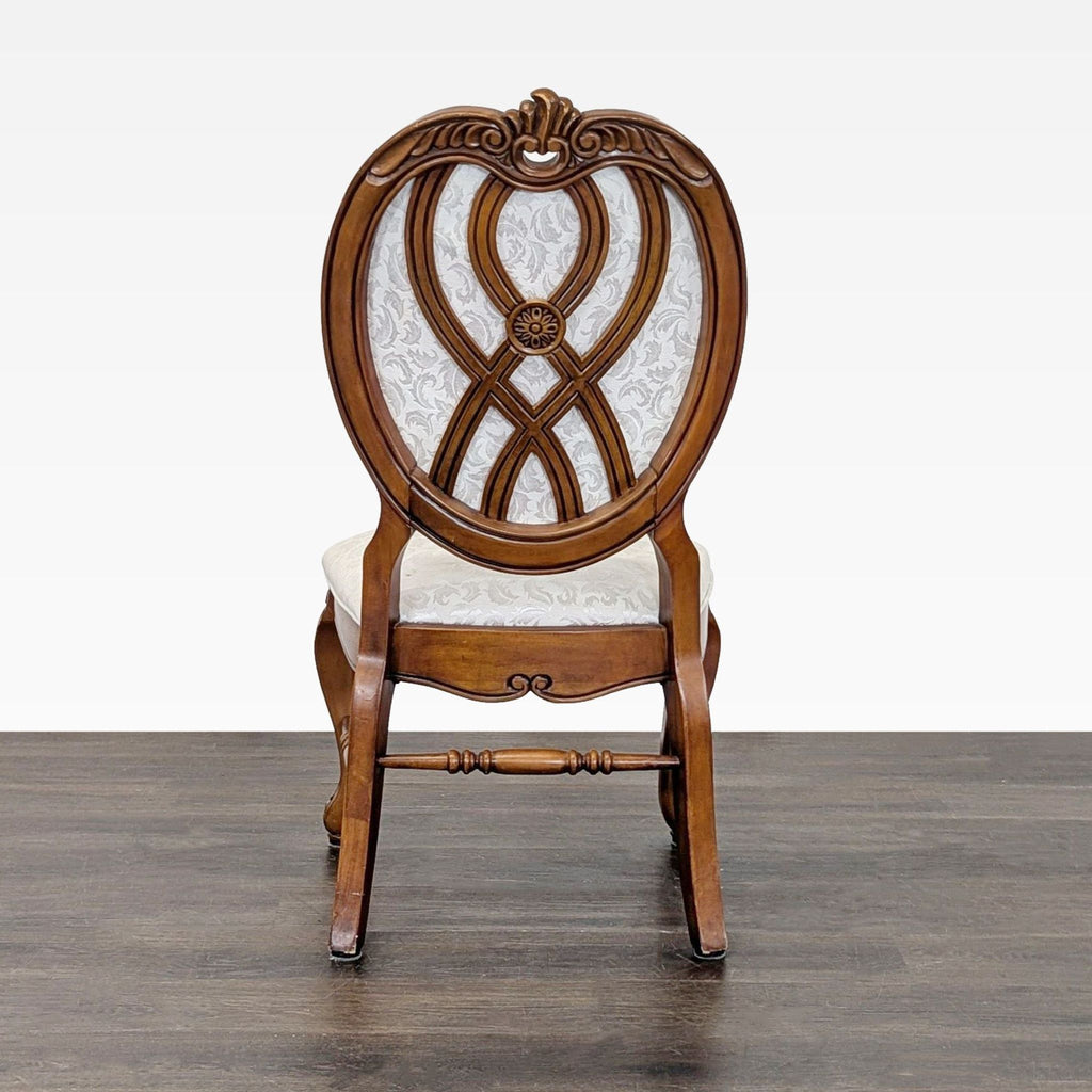 1. Modern dining chair with upholstered seat and wooden legs, positioned at a dining table.