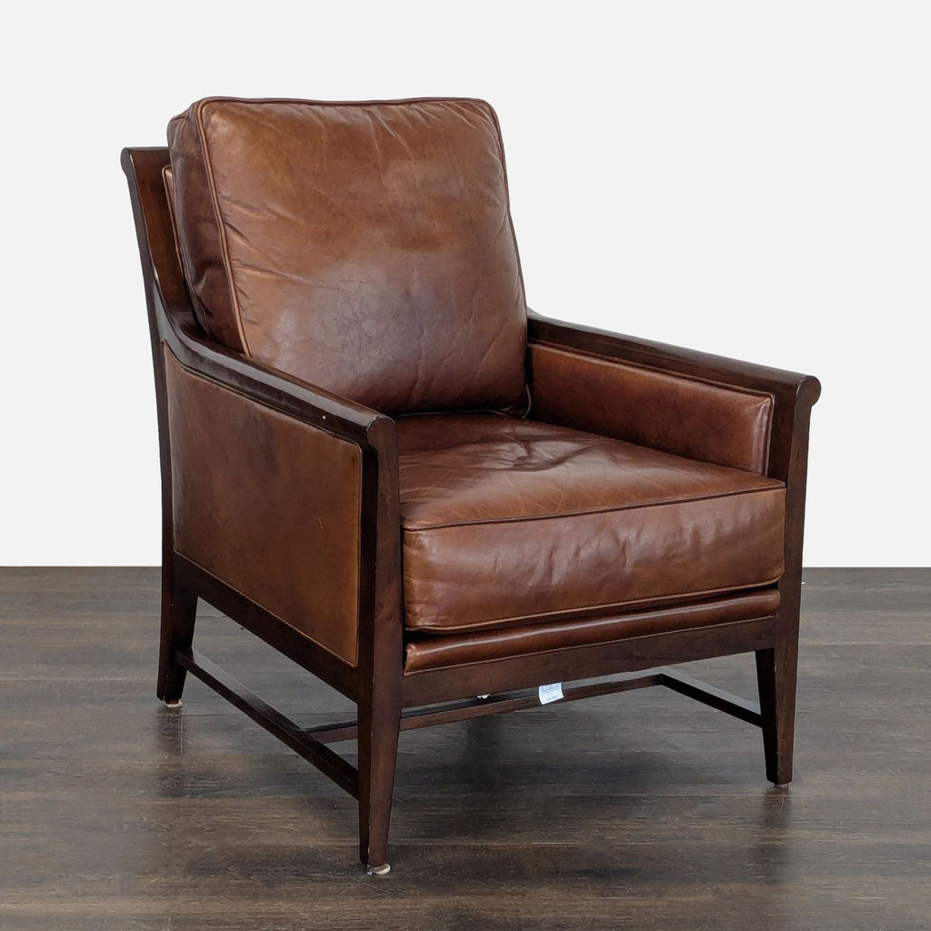 Elegant lounge chair featuring soft brown leather cushions and sturdy wood frame, perfect for modern interiors.
