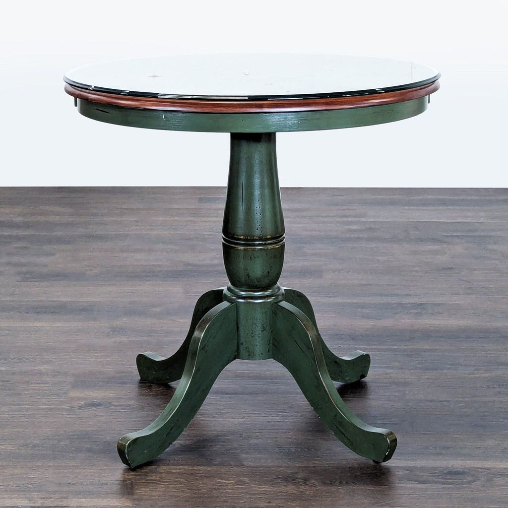 Distressed green wood end table from Pier 1 Imports with a glass top for protection and style.  