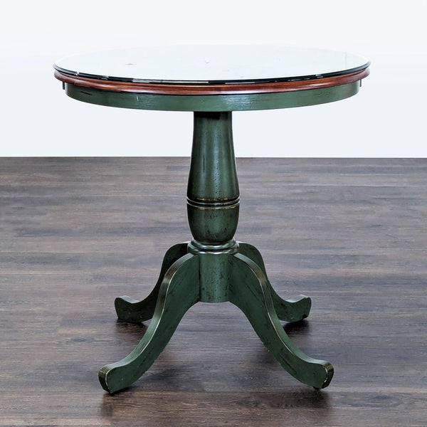 Distressed green wood end table from Pier 1 Imports with a glass top for protection and style.  