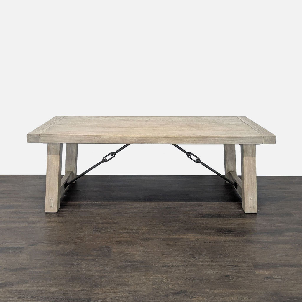 Rectangular light-finished wood dining table and six chairs from Pottery Barn; sturdy, stylish, and versatile.