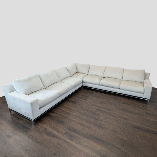 Modern A. Rudin light beige L-shaped sectional sofa with plush cushions and metal legs, ideal for group seating.