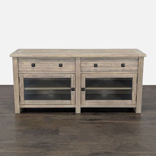 Rustic Pottery Barn entertainment center with two drawers, glass cabinets, and wood finish.
