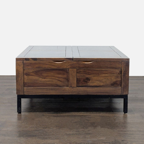 Crate & Barrel coffee table with wood lift-top, storage compartments, and a metal base.