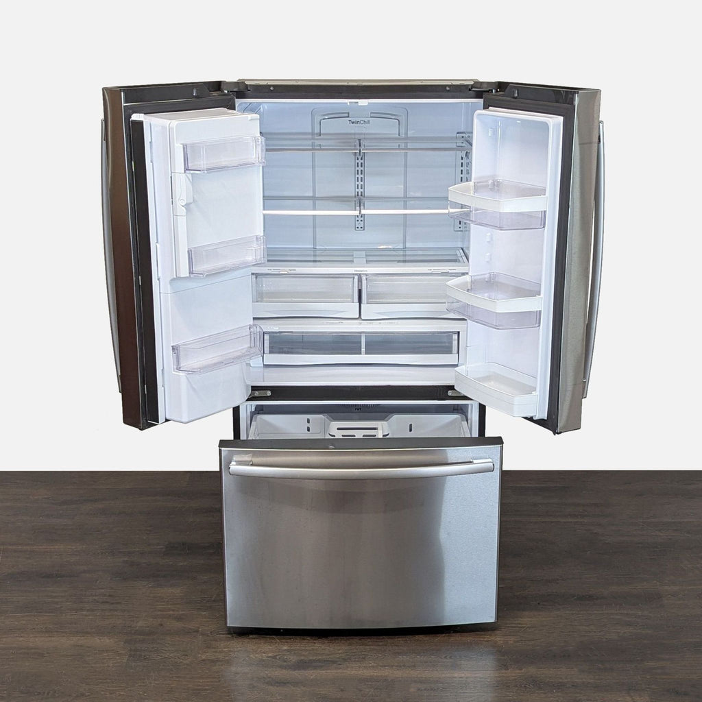 Modern GE refrigerator in stainless steel; features spacious interior and adjustable shelves for easy storage.