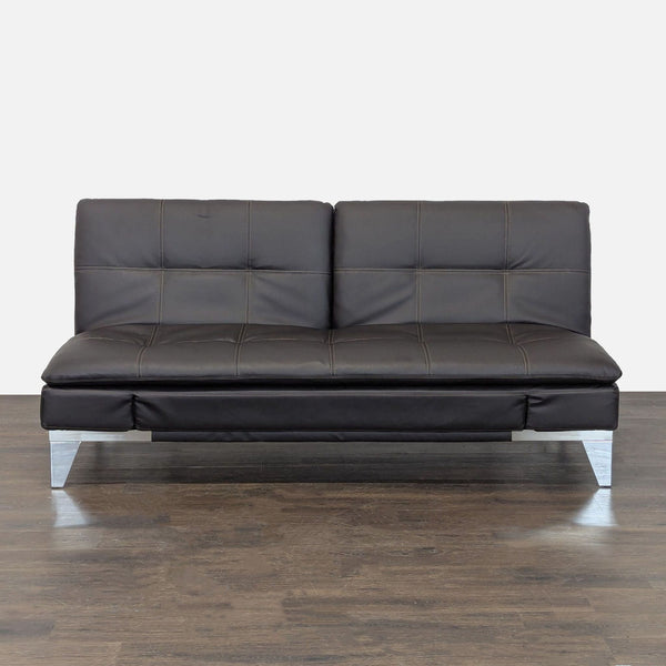 Relax-A-Lounger 3-seat sofa with dark faux leather, metal legs, and a modern convertible design for small spaces.