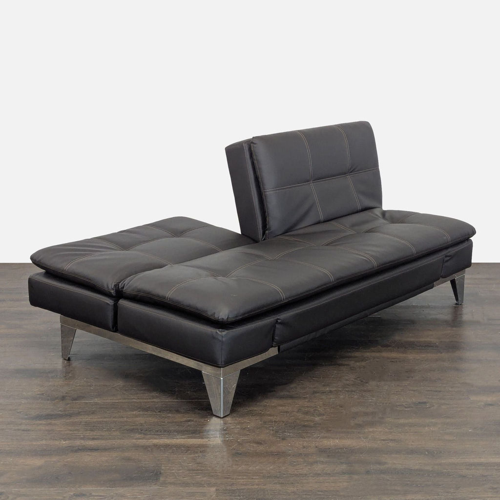 2. Contemporary Relax-A-Lounger brand 3-seater couch with sleek armrests.