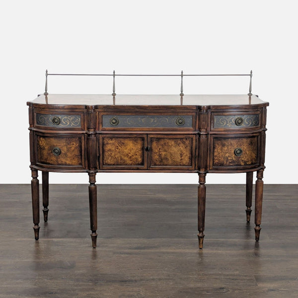 Elegant wood sideboard with burl veneer, metal inlays, ornate drawers, ring pulls, and six pin legs.