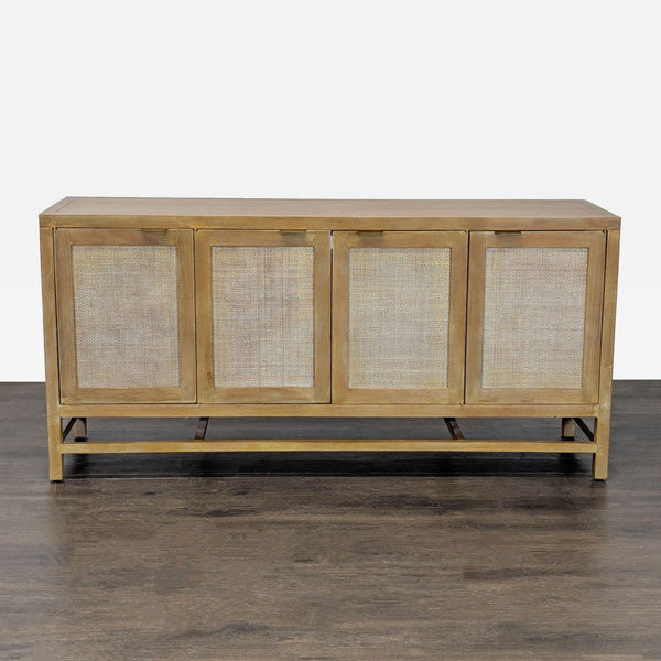 Teak entertainment center with rattan doors and antique brass pulls by Crate & Barrel.  