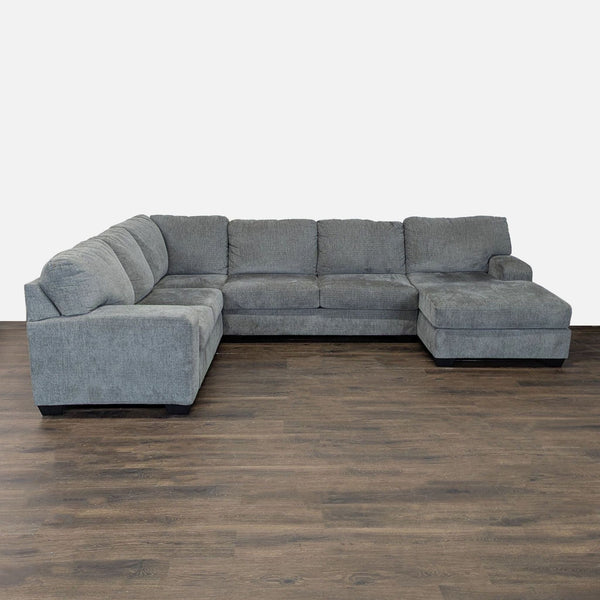 Modern Ashley Furniture sectional in gray fabric with chaise lounge, L-shape design, and spacious seating.  