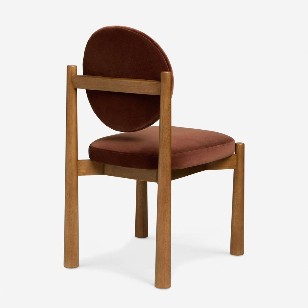 2. Elegant dining chair from Lulu and Georgia featuring smooth curves and neutral upholstery, ideal for stylish dining rooms.