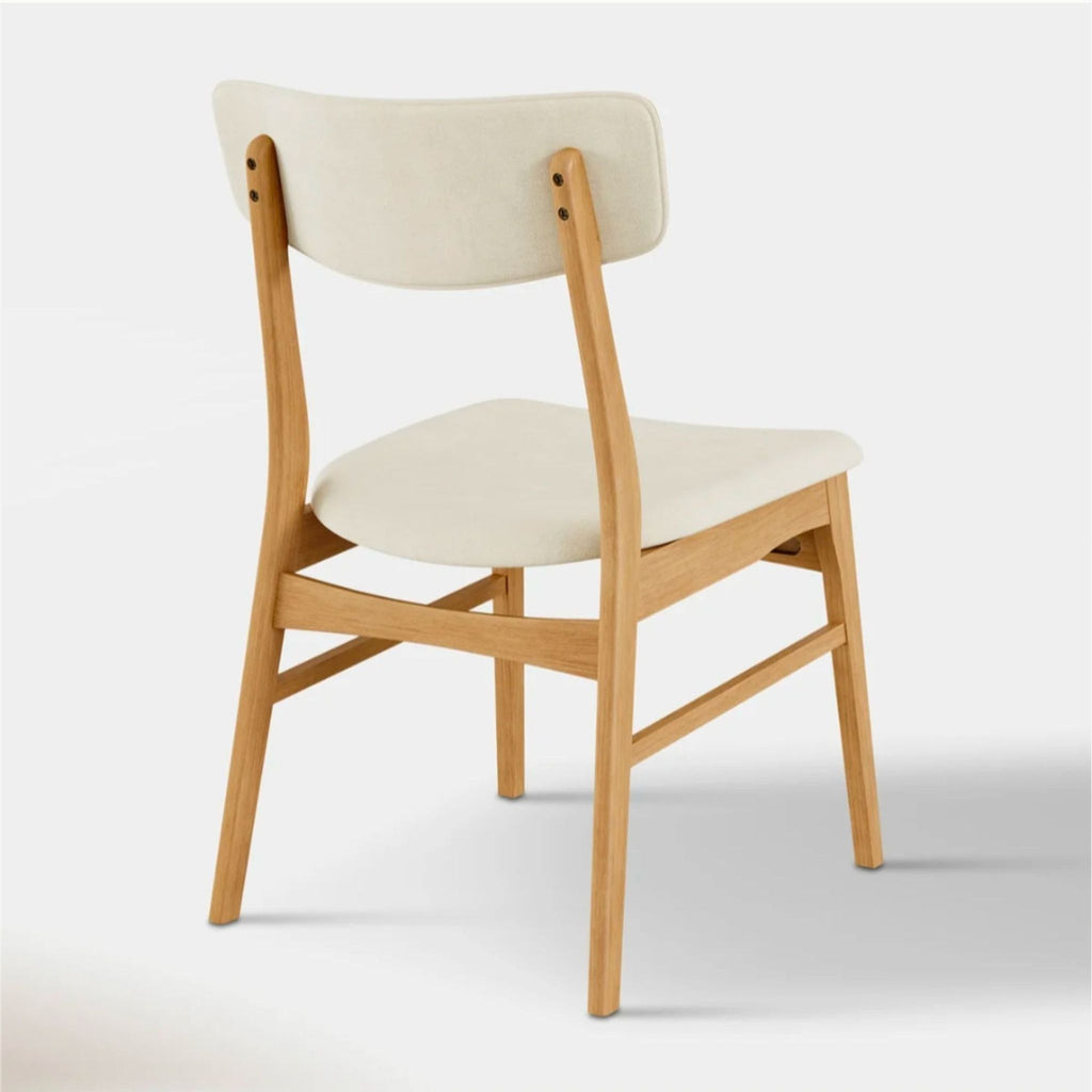 3. Upholstered dining chair from Hoft Home, made of oak with padded seat and back.