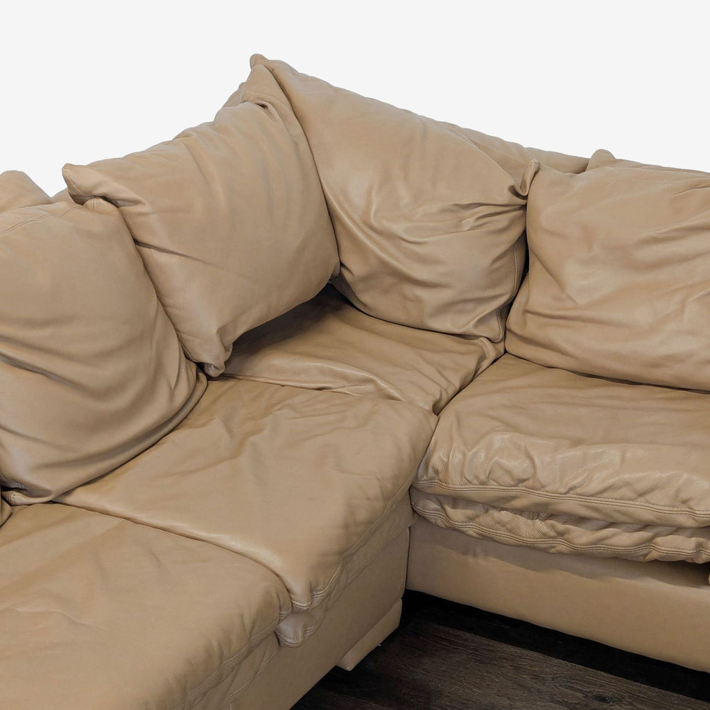 Large tan sectional sofa with soft cushions and sturdy build; ideal for family living rooms, lightly used.