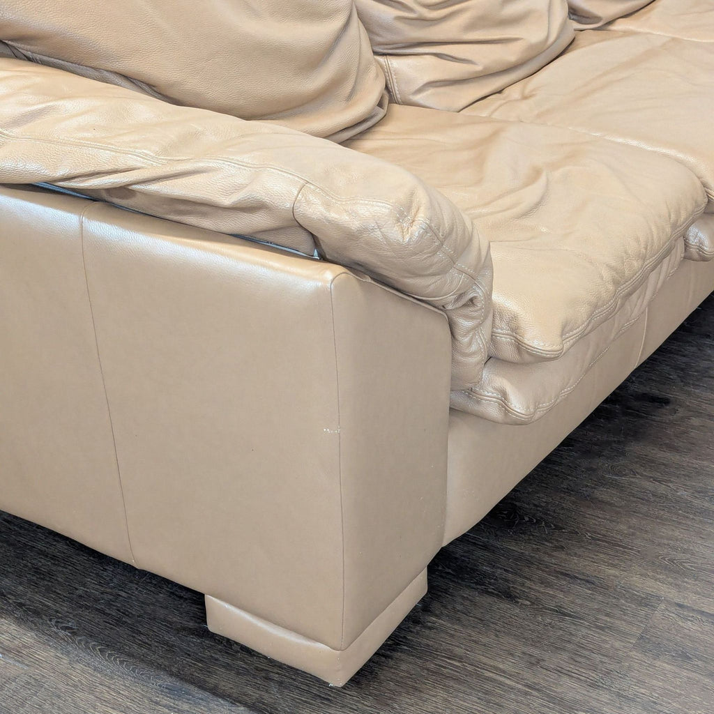 Large Tan Leather Sectional Sofa with Cushioned Seats