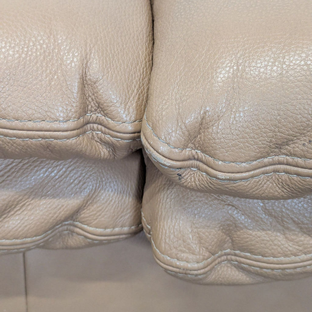 Large Tan Leather Sectional Sofa with Cushioned Seats
