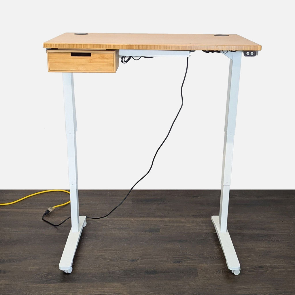 Modern bamboo Uplift standing desk features smooth height adjustment, storage drawer, cable grommets, and mobile white frame.