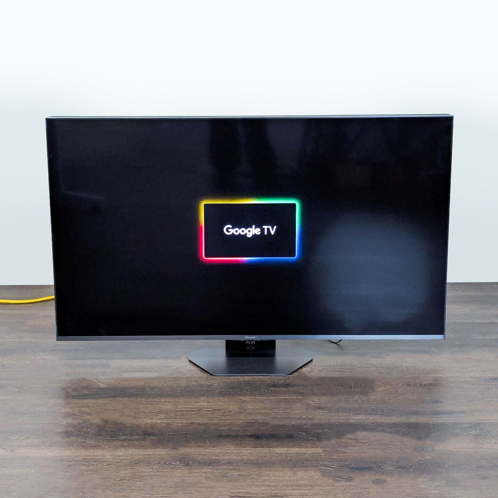 Modern Hisense 55-inch TV featuring a slim bezel, included stand, and smart streaming via Google TV interface.
