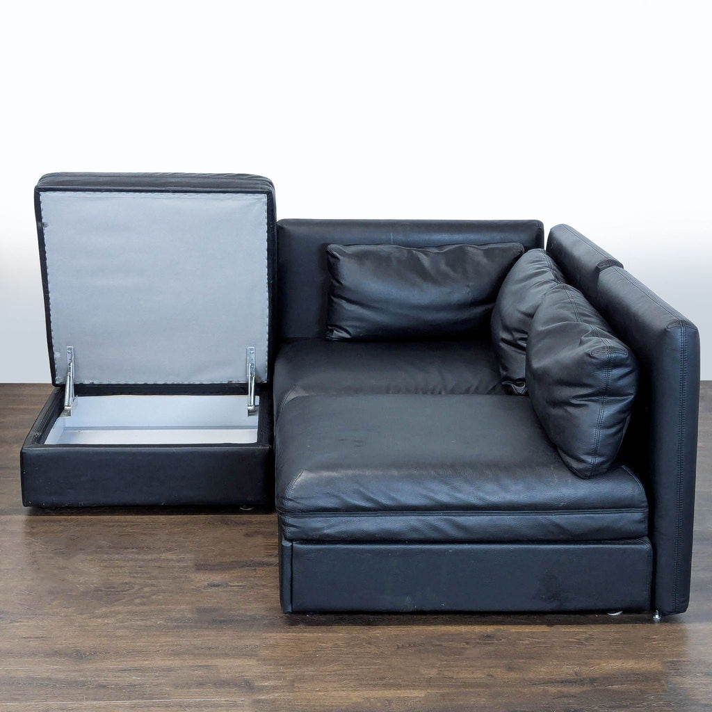 Sectional sofa set in black faux leather, featuring modular pieces, pull-out bed, and storage ottoman.