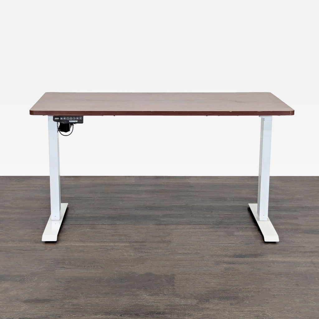 Flexispot standing desk with a wooden top and white frame, equipped with electric height adjustment.