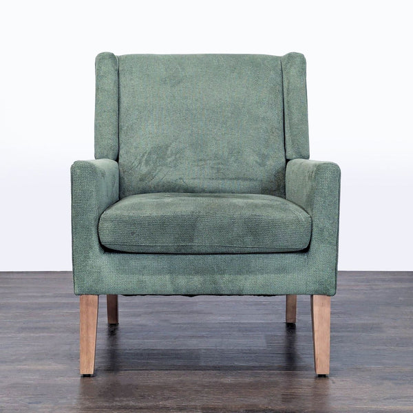 Colamy green fabric lounge chair with wooden legs, soft cushioned seat, and modern design.