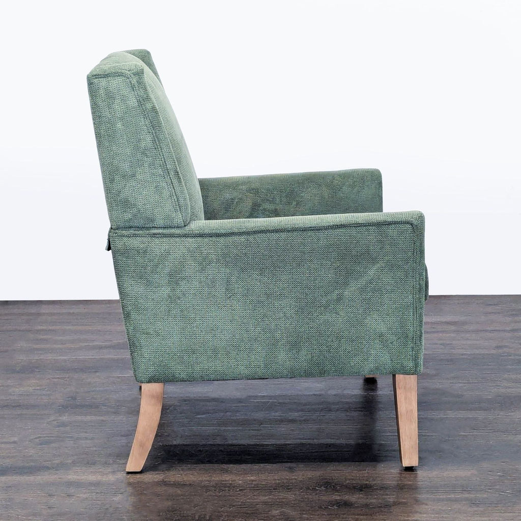 Soft green Colamy lounge chair with plush seat and back, stylish wooden legs, and a cozy look.