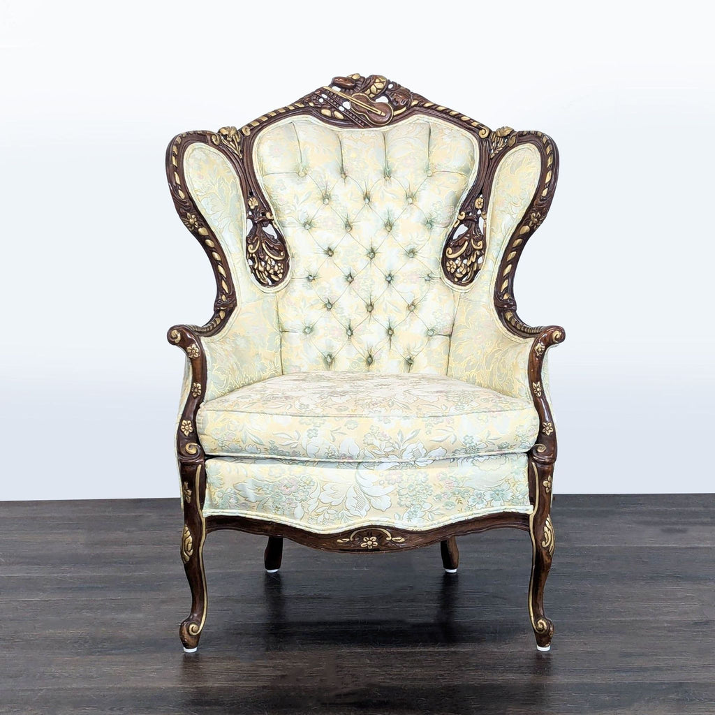 Victorian style lounge chair with a tall tufted back, floral upholstery, and carved dark wood frame.