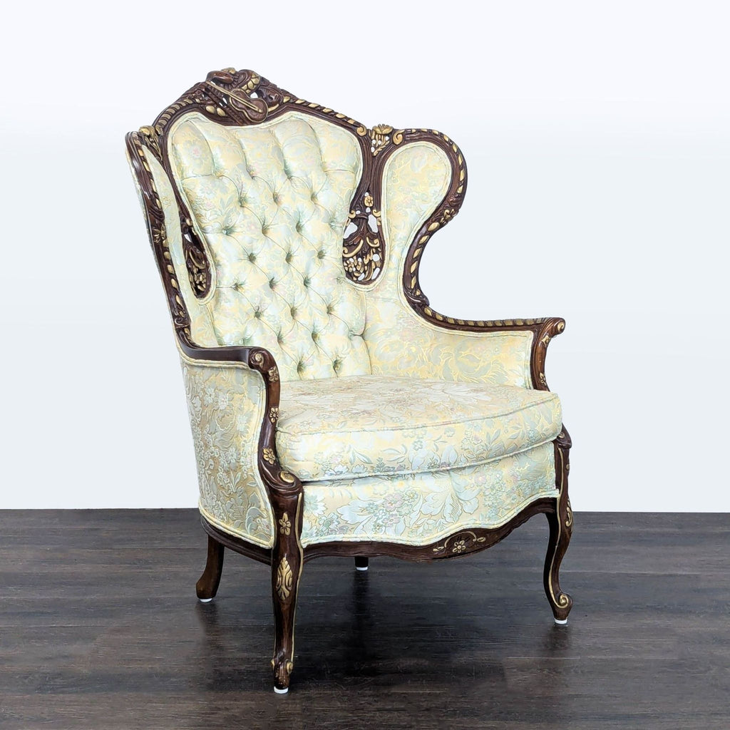 Tall-back lounge chair with intricate wood carving, tufted upholstery, and floral fabric; a stylish vintage piece.