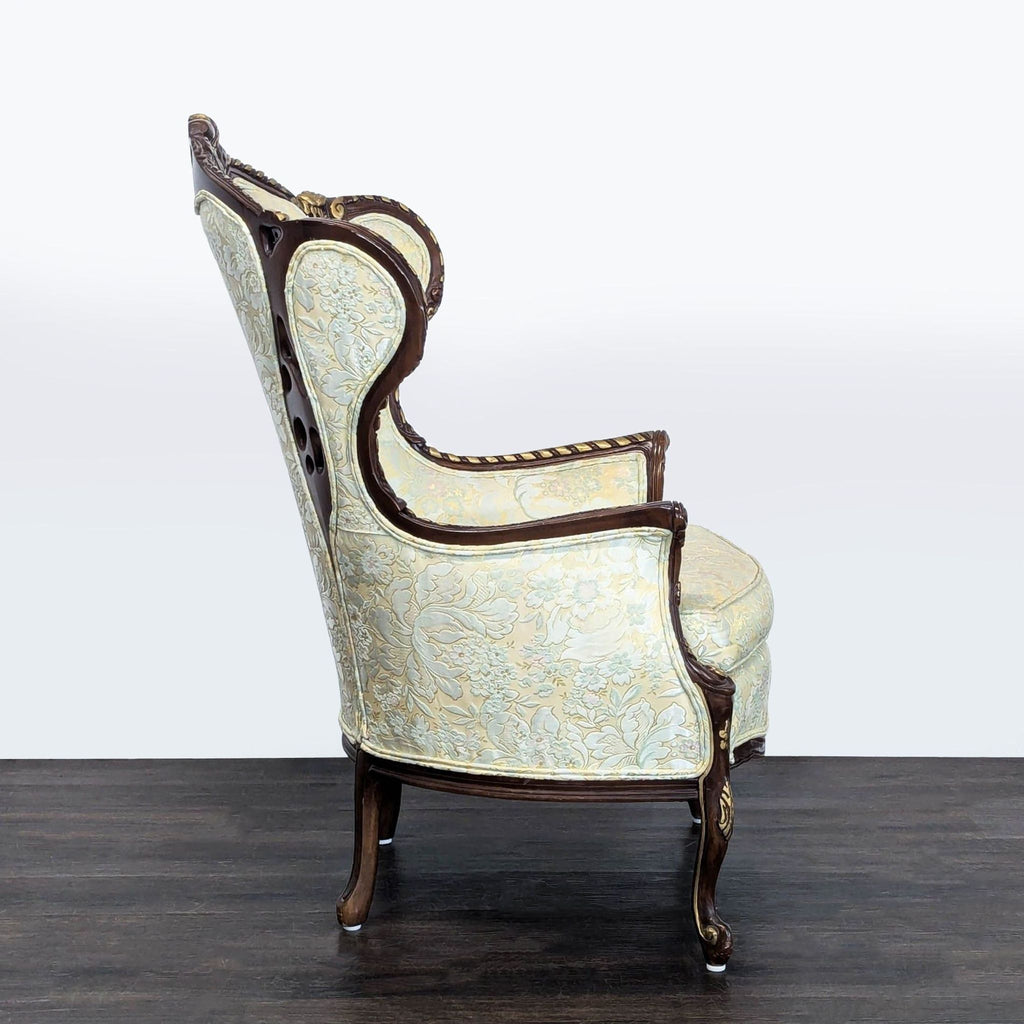 Elegant Hausske-Harlen lounge chair featuring floral fabric, ornate woodwork, and classic Victorian charm.