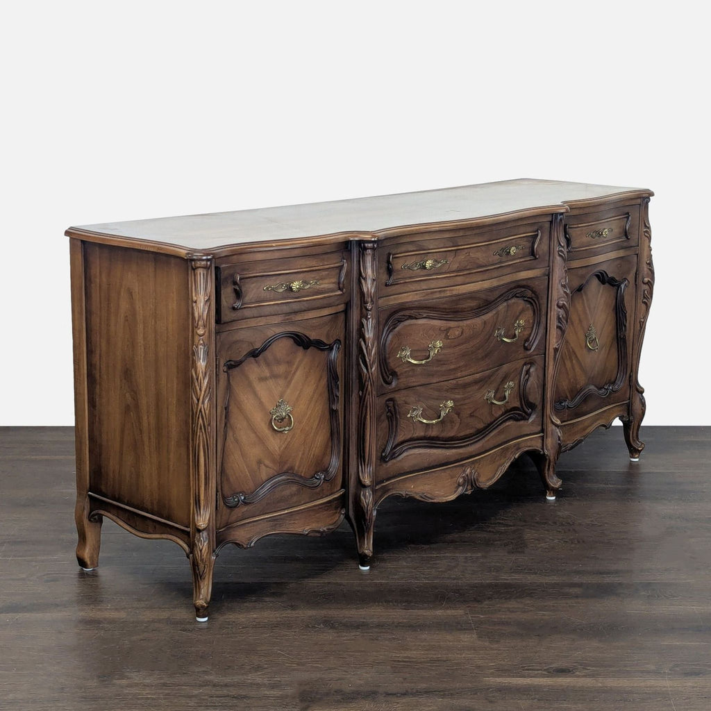 Elegant French Provincial credenza with intricate handles, spacious storage, and rich wood detailing.
