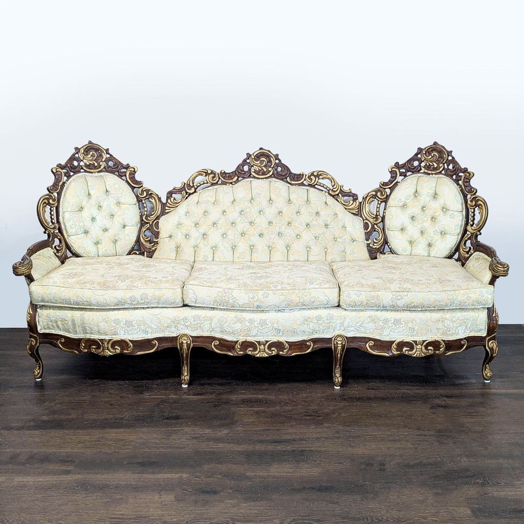 Vintage Hausske-Harlen 3-seat sofa with ornate wood carving, floral upholstery, and gold accents.