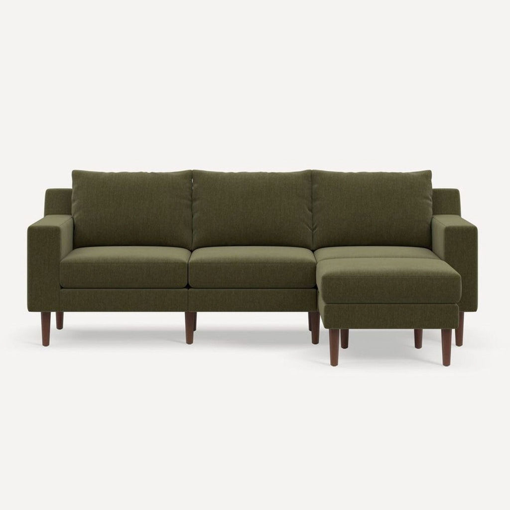 2. Stylish Burrow L-shaped sectional with plush cushions and wooden legs, shown from an angled view.