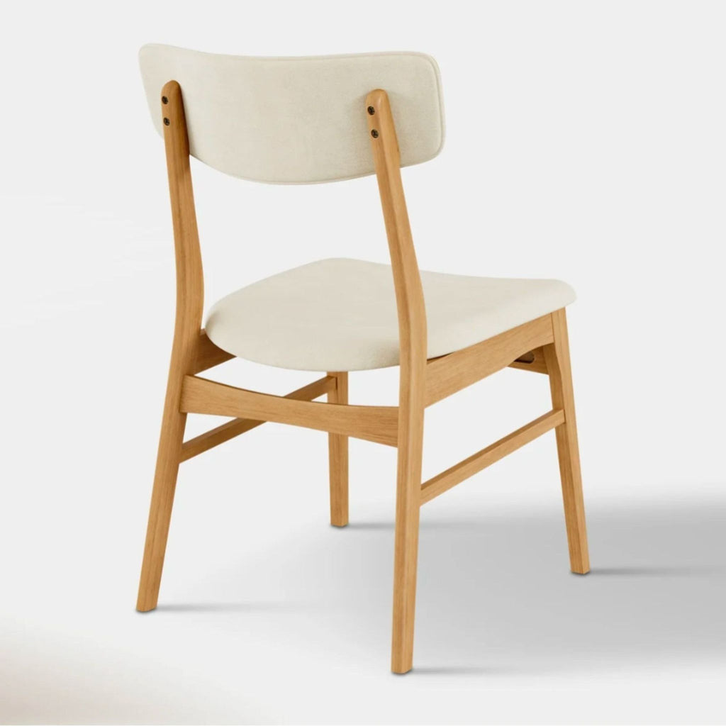 3. Upholstered dining chair from Hoft Home, made of oak with padded seat and back.
