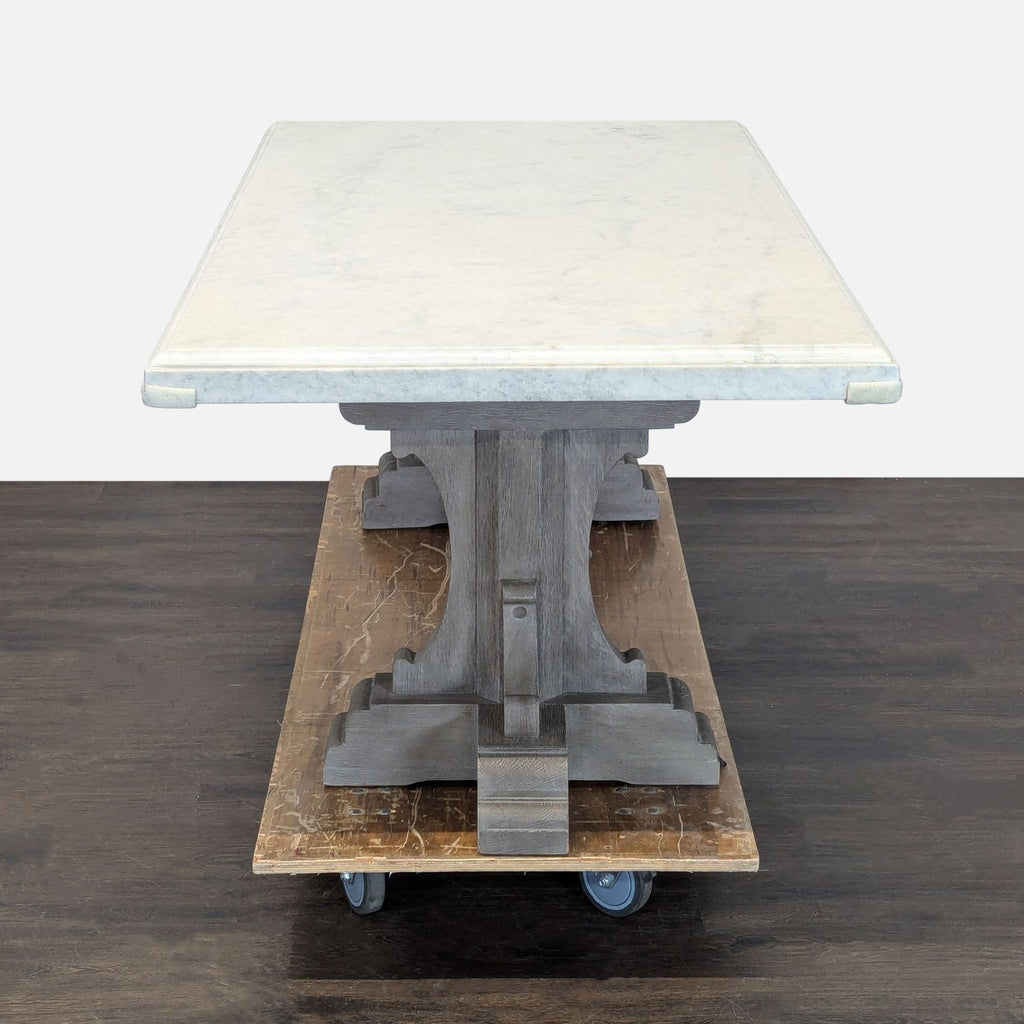 Sophisticated Restoration Hardware dining set, including a sturdy marble table and comfortable upholstered seating.