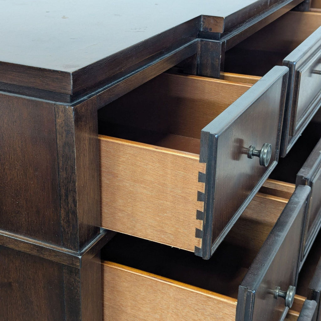 1. Modern wooden dresser with six drawers and minimalist metal handles, set against a white background.