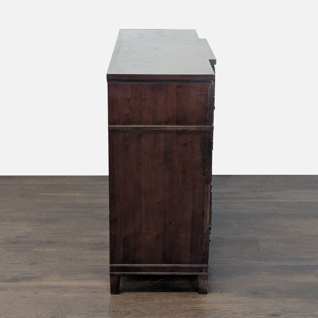 2. Sleek black dresser featuring spacious drawers and a smooth top, ideal for bedroom storage.