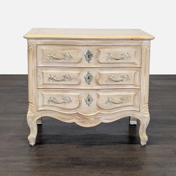 Henredon French Provincial end table with cream and light wood finish, three drawers, and ornate handles.  