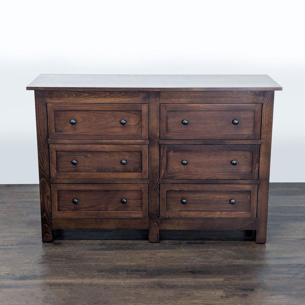 1. Modern Room & Board dresser with clean lines, wooden finish, and multiple spacious drawers for storage.