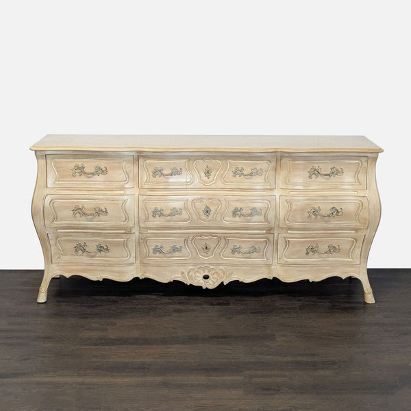 Henredon French Provincial dresser with nine drawers, ornate handles, and a light distressed finish.  